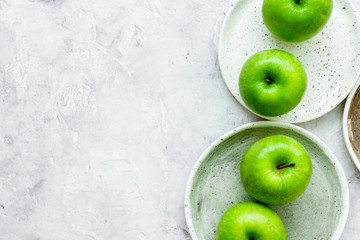 Healthy green food with apples on plates stone background top vi