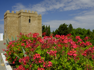 Fototapeta na wymiar View of Torre Castillo de dona Blanca and gardens in spring sunshine, near El Puerto de Santa Maria, Andalucia, Spain