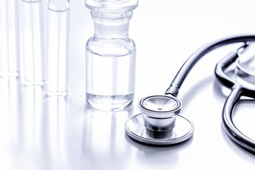 medicine set with stethoscope and vials on doctor's workplace ba
