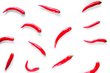 red food with chili pepper on white background top view pattern