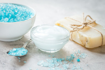 Fototapeta na wymiar spa composition with blue sea salt and natural soap on stone des