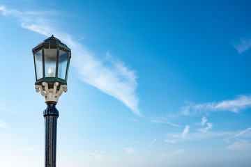 Fototapeta na wymiar Old Fashioned Lamp on Blue Sky