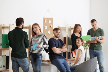 Students doing homework together in classroom