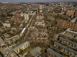 Clouds in the blue sky wih buildings under them at Novosibirsk, Russia. Streets and skyline.