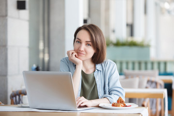 Beautiful young woman working in morning time