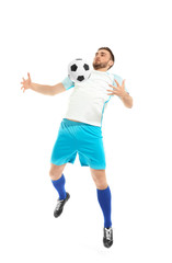 Fototapeta premium Young man playing football on white background