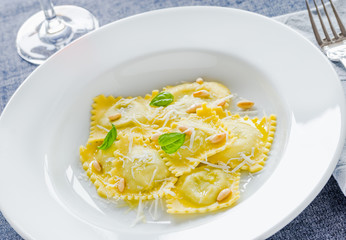 Italian ravioli plate close up. Ravioli with ricotta and spinach.