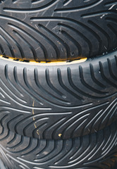 Close up of Racing car tires storage. Storage of tires in a row