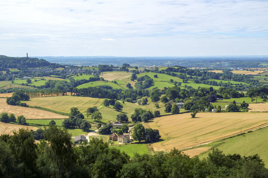 Summer view from the Cotswold Edge looking towards the Tynedale Momument from a viewpoint on Stinchcombe Hill near Dursley, Gloucestershire, UK