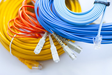 SKS and engineering concept. Set of connectors, ethernet, console cables and crimp tool on the blue...