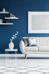 Couch on blue wall