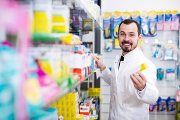 Positive man pharmacist offering right drug