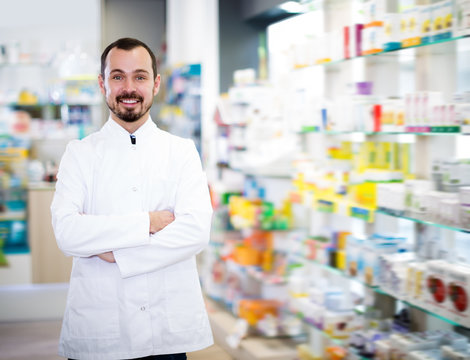 Young pharmacist showing assortment