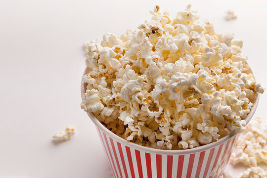 Bucket of popcorn on white background