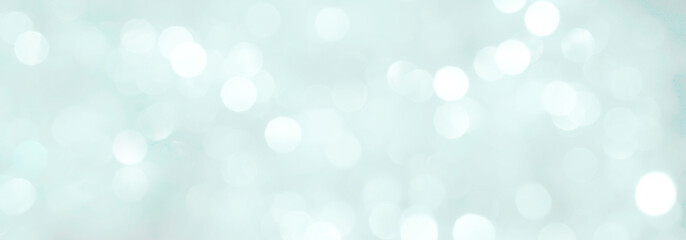 Fototapeta na wymiar Blurred shiny blue background for New Year's greeting card. Fashionable colors palette - Marina.
