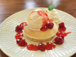 Pancake with vanilla ice cream and cherry sauce