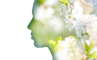 beauty, nature and ecology concept - portrait of woman profile with white spring blossoms, double exposure effect