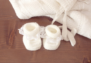 Fototapeta na wymiar Knitted baby slippers