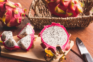 Fresh dragon fruit on wooden table