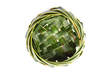 Bowl of coconut leaves on white background