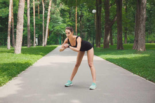 Fitness woman at stretching training outdoors