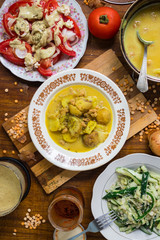 Hot  delicious peas creamy lentil soup puree with new backed potatoes with olive oil, turmeric powder, spices and herbs. Mixed with blender. Raw vegan vegetarian healthy food on lunch or dinner