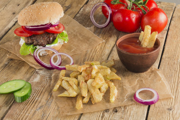 Delicious burgers with beef, tomato, cheese and lettuce
