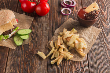 Delicious burgers with beef, tomato, cheese and lettuce
