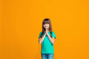 Happy success teen girl celebrating being a winner. Dynamic energetic image of female model