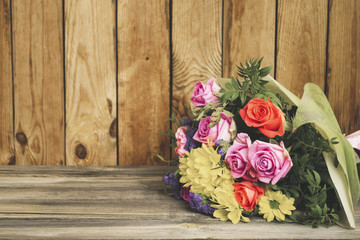 beautiful bouquet of flowers on an old wooden background