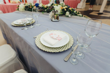 Banquet decorated table, with cutlery. Wedding decor in the banquet hall.Serving of a festive table