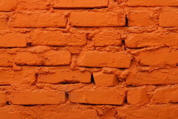Old brick wall painted in orange color