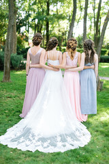 celebration, engagement, bridesmaid concept. backs of four young slim beautiful women, happy bride...