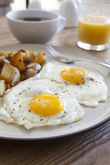 Fototapeta premium Fried Eggs and Hash Browns