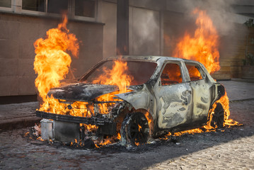Fire engulfing a car 