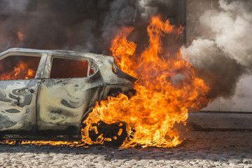 Fire engulfing a car 