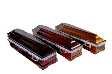 Three open wooden coffins isolated