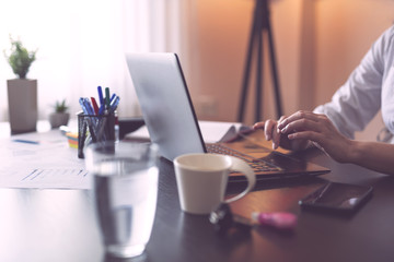 Businesswoman typing on a laptop computer