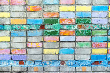 Multicolored brick wall, background