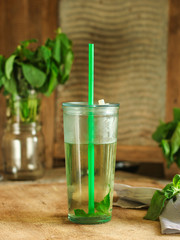 mint lemonade in a transparent glass  (fresh petals of mint in the cooled drink)