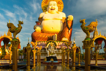 Wat Plai Laem Buddhist Temple statues during a sunset in Koh Samui, Surat Thani, Thailand