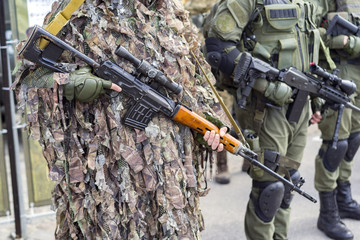 Sniper military or special forces or special forces, soldiers with guns standing in a row, military...