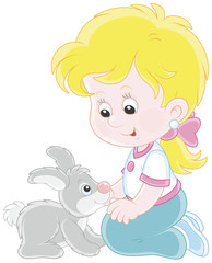 Little smiling girl playing with her small grey rabbit, vector illustration in a cartoon style
