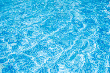 Abstract water wave, sun reflections in pool water