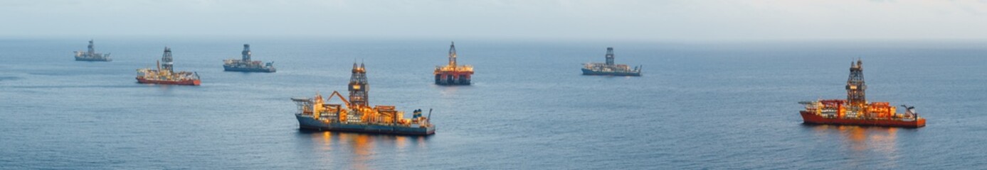 offshore oil platform and gas drillship with illumination, panoramic view