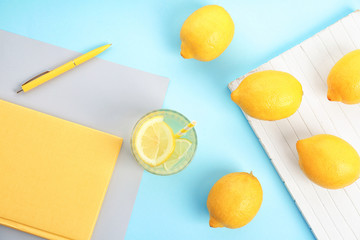 Flat lay composition with delicious natural lemonade on color background