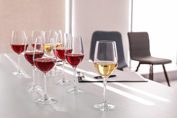 Glasses with delicious wine on table indoors