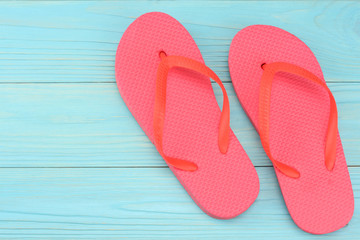 Summer blue background. Top view of beach summer accessories on blue wooden background with copy...