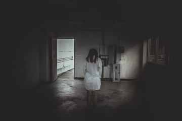 Close up woman wear white shirt in the dark room,Scary movie concept,Horror background,Thailand people