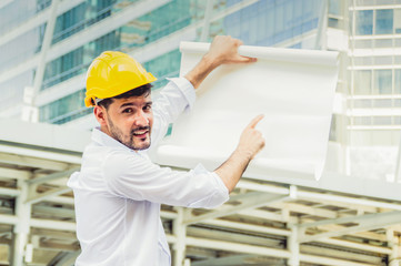 Professional engineers, young men and young women are planning construction.